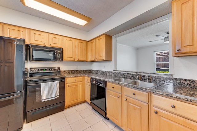 kitchen featuring sink, light tile patterned floors, black appliances, dark stone counters, and light brown cabinets