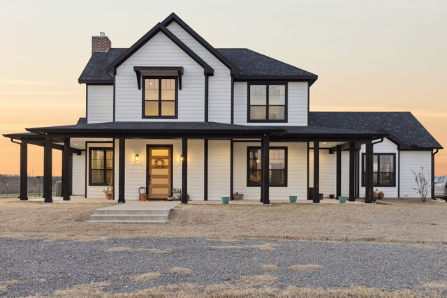 birds eye view of property featuring a rural view