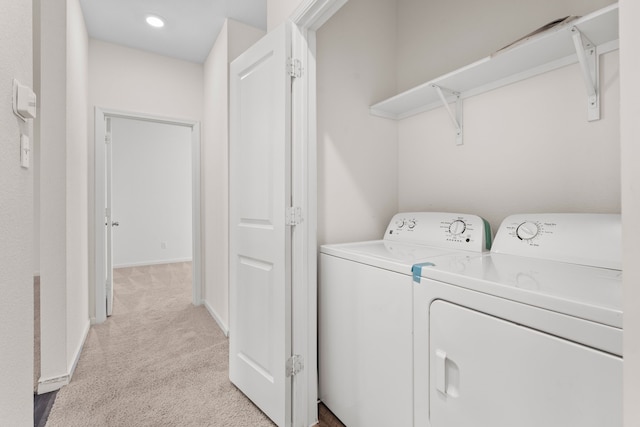 washroom featuring light colored carpet and separate washer and dryer