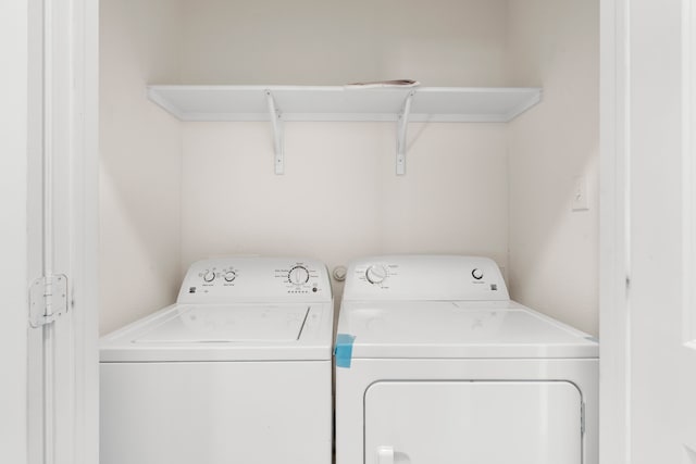 laundry room with washing machine and clothes dryer