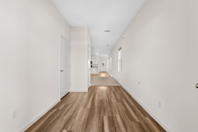 hallway featuring wood-type flooring