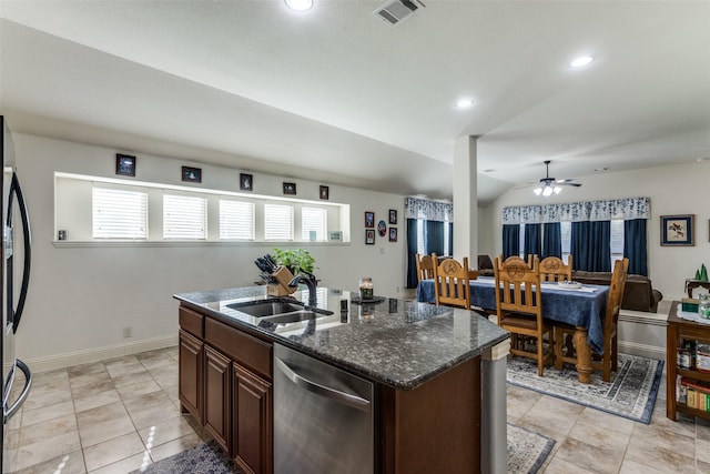 kitchen featuring a center island with sink, appliances with stainless steel finishes, ceiling fan, plenty of natural light, and sink