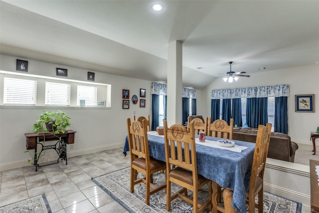 dining space with vaulted ceiling, ceiling fan, and light tile patterned floors