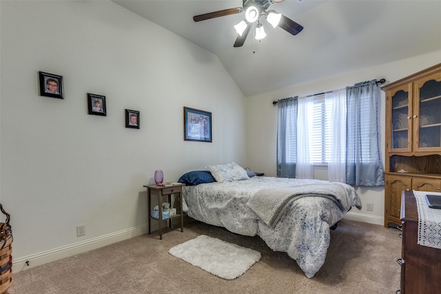 carpeted bedroom featuring ceiling fan and lofted ceiling