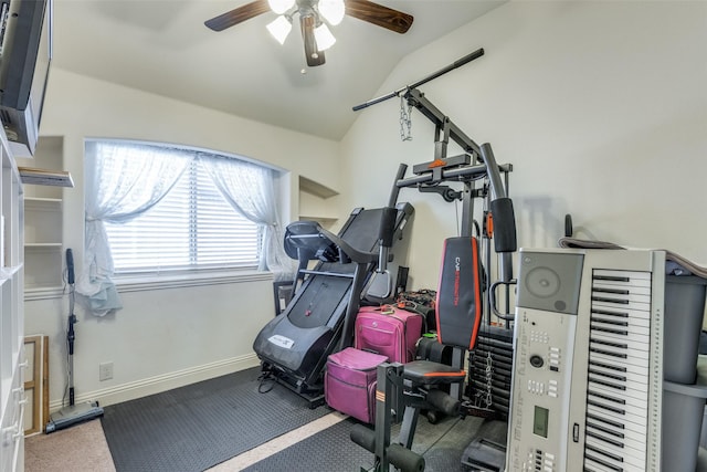 exercise area with ceiling fan and vaulted ceiling