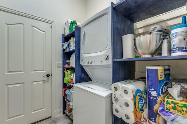 laundry area with stacked washer and clothes dryer