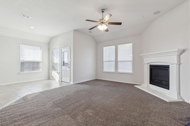 unfurnished living room featuring ceiling fan, light carpet, and vaulted ceiling