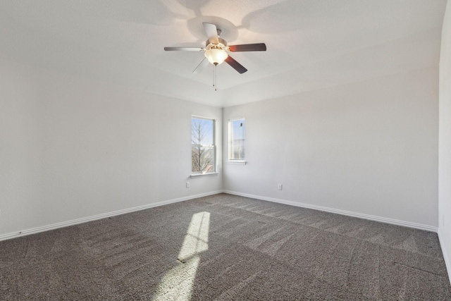 carpeted empty room featuring ceiling fan