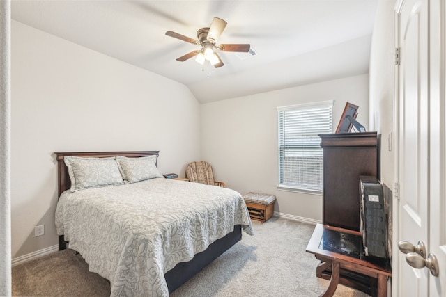 bedroom with light carpet, ceiling fan, and vaulted ceiling