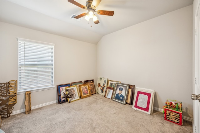 game room featuring vaulted ceiling, ceiling fan, and light colored carpet