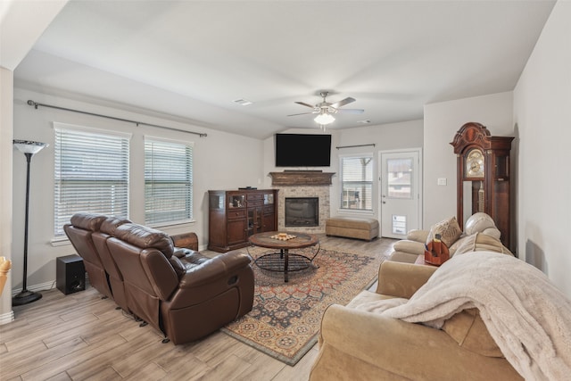 living room featuring ceiling fan and lofted ceiling