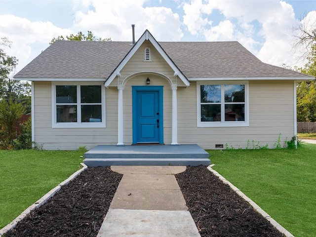 view of front of home with a front lawn