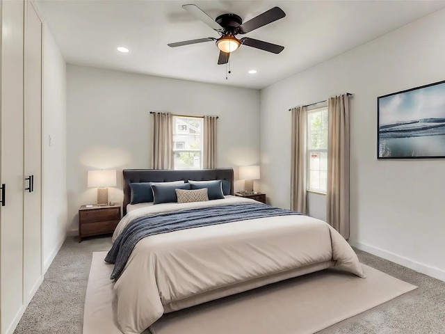 carpeted bedroom with ceiling fan