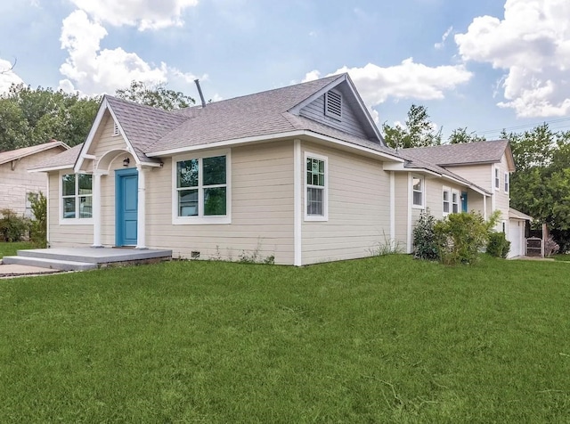 view of front facade with a front lawn and a garage