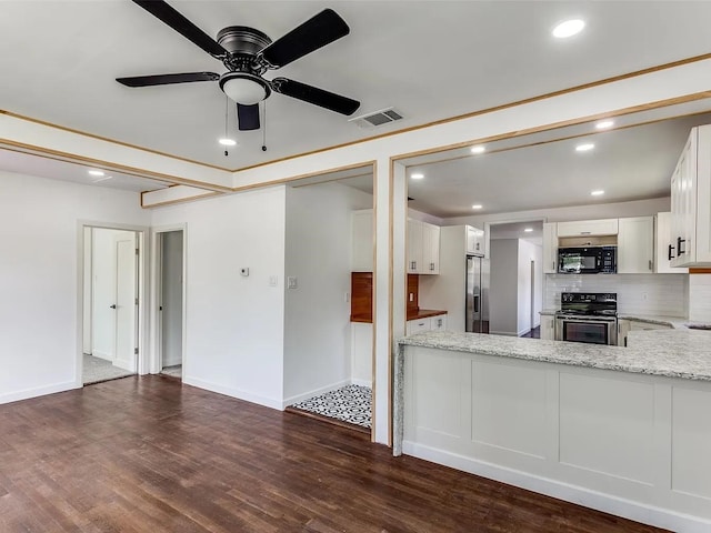 kitchen featuring stainless steel appliances, ceiling fan, dark wood-type flooring, light stone counters, and white cabinetry