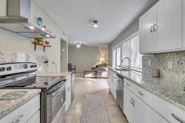 kitchen featuring sink, stainless steel appliances, white cabinets, ventilation hood, and light stone counters