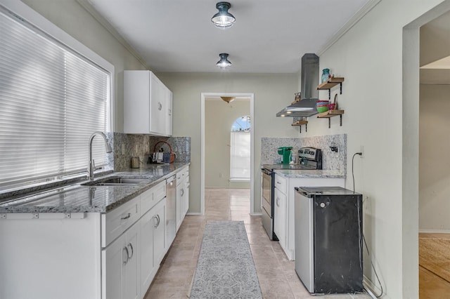 kitchen with backsplash, range hood, sink, white cabinetry, and stainless steel appliances