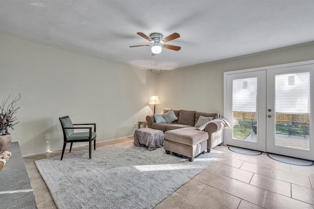 living room featuring ceiling fan, light tile patterned floors, french doors, and a textured ceiling