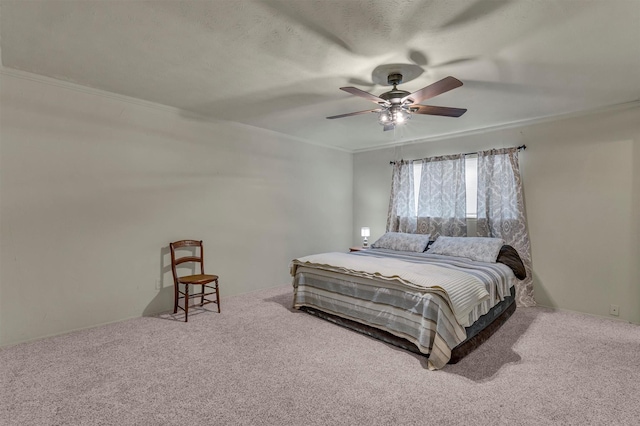 bedroom with ceiling fan, carpet, and crown molding