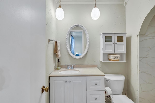 bathroom featuring toilet and vanity