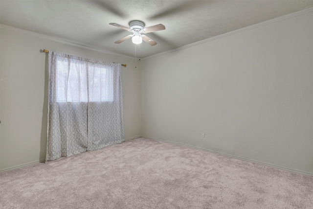 unfurnished room with light carpet, ceiling fan, ornamental molding, and a textured ceiling