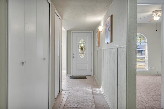 corridor with light colored carpet