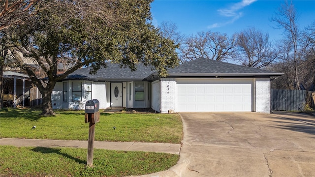 single story home with a front yard and a garage