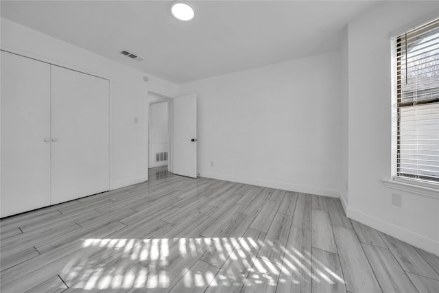 unfurnished bedroom featuring a closet