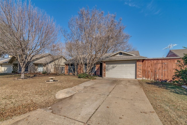 ranch-style home featuring a front yard and a garage