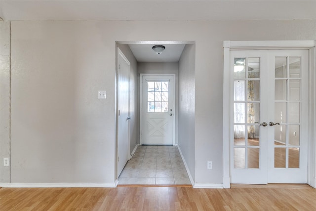 doorway featuring french doors and light hardwood / wood-style floors