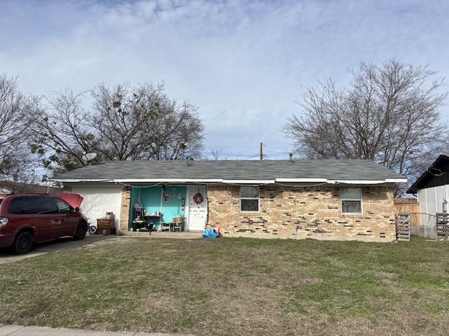 ranch-style home with a front lawn