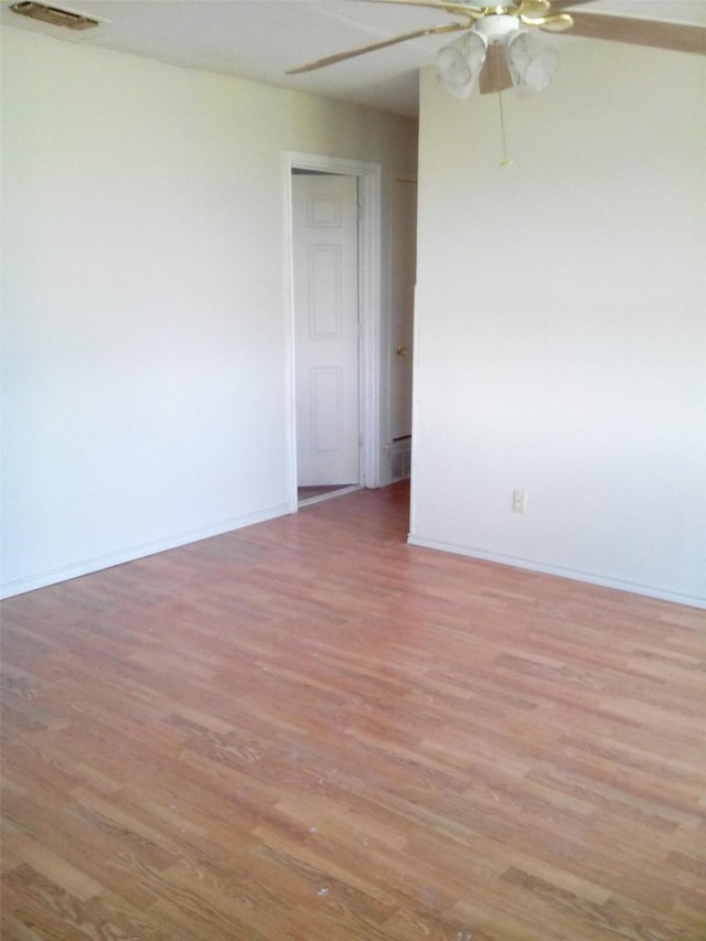 spare room with light hardwood / wood-style floors