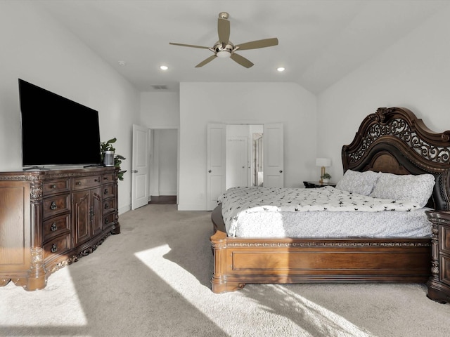 carpeted bedroom featuring ceiling fan and lofted ceiling