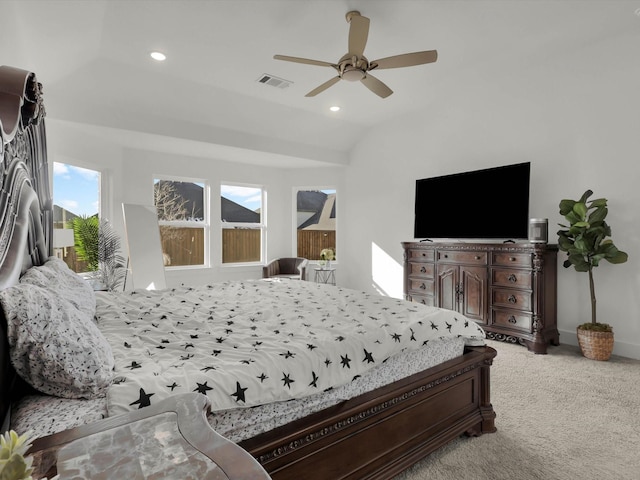 carpeted bedroom featuring ceiling fan and vaulted ceiling