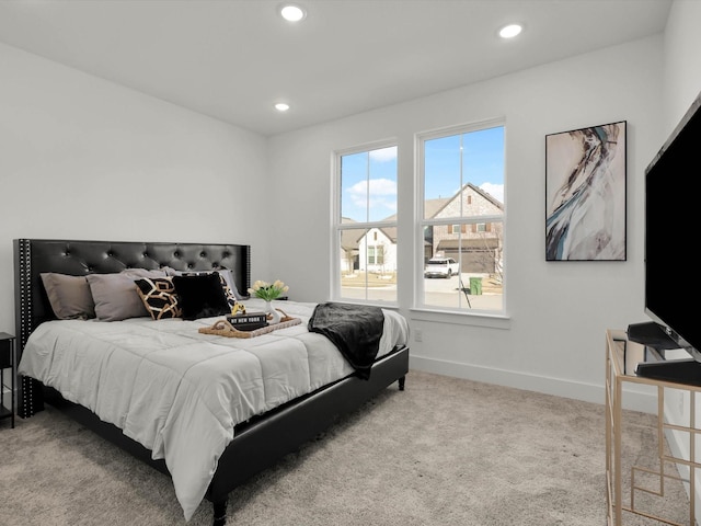 bedroom featuring light colored carpet