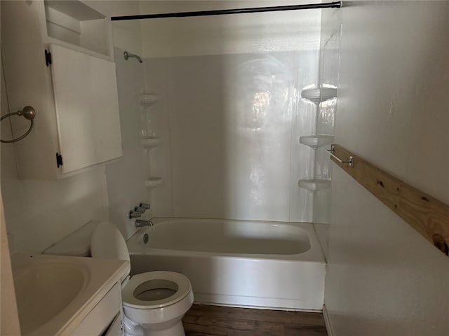 full bathroom with tub / shower combination, hardwood / wood-style floors, vanity, and toilet