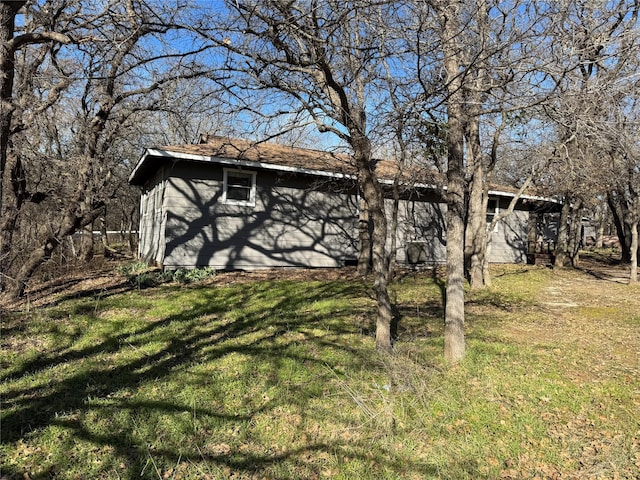 back of house with a yard