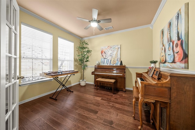 misc room featuring crown molding, ceiling fan, and dark hardwood / wood-style floors