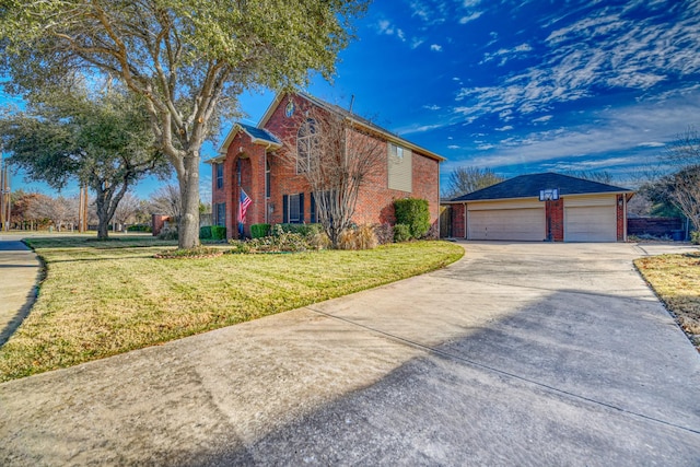 view of front of house featuring a front lawn, a garage, and an outdoor structure