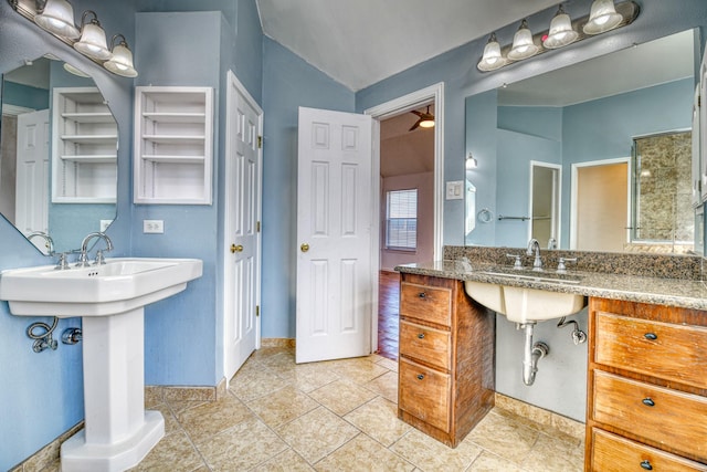 full bath with vaulted ceiling and a sink