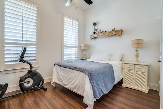 bedroom featuring dark wood-type flooring and ceiling fan