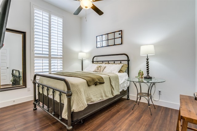 bedroom featuring dark wood-type flooring and ceiling fan