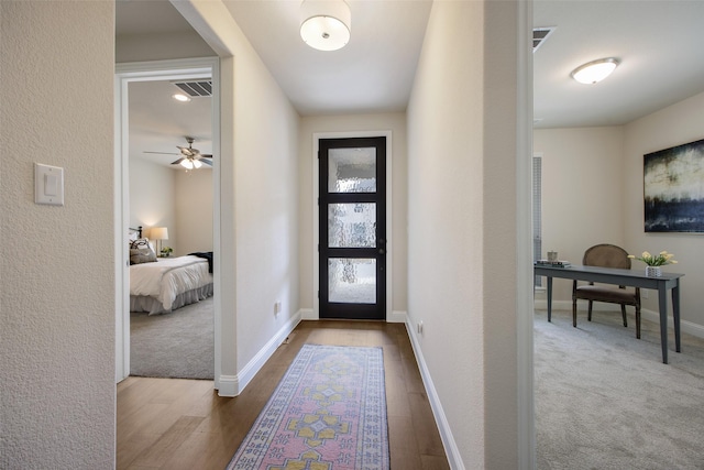 foyer with ceiling fan and hardwood / wood-style flooring