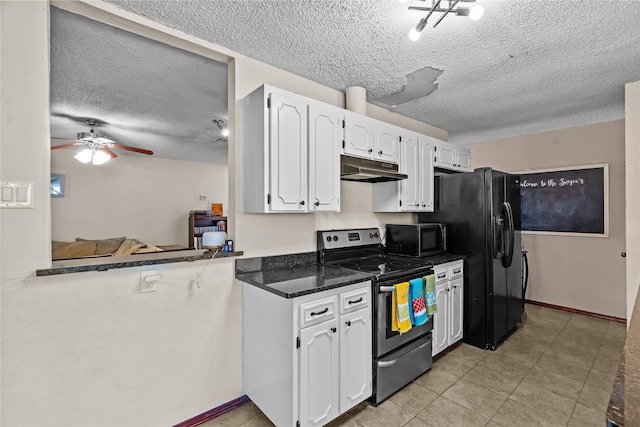 kitchen with dark stone countertops, black appliances, kitchen peninsula, and white cabinets