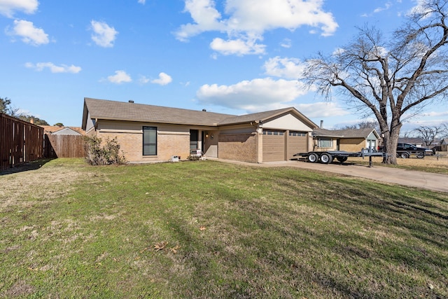 ranch-style home with a garage and a front lawn