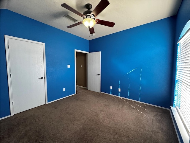 unfurnished bedroom with carpet flooring and ceiling fan