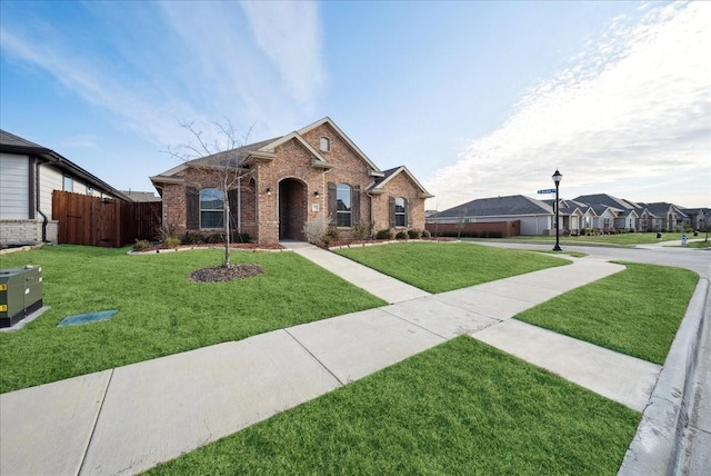 single story home with a front yard