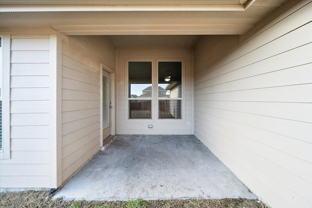 entrance to property featuring a patio area