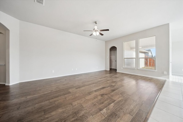 unfurnished living room featuring hardwood / wood-style flooring and ceiling fan