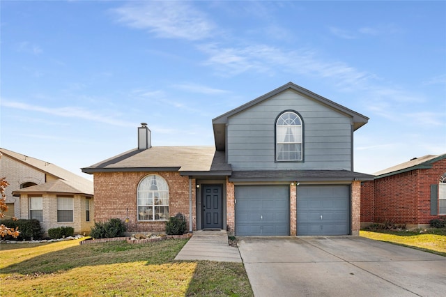 view of front property with a garage and a front yard